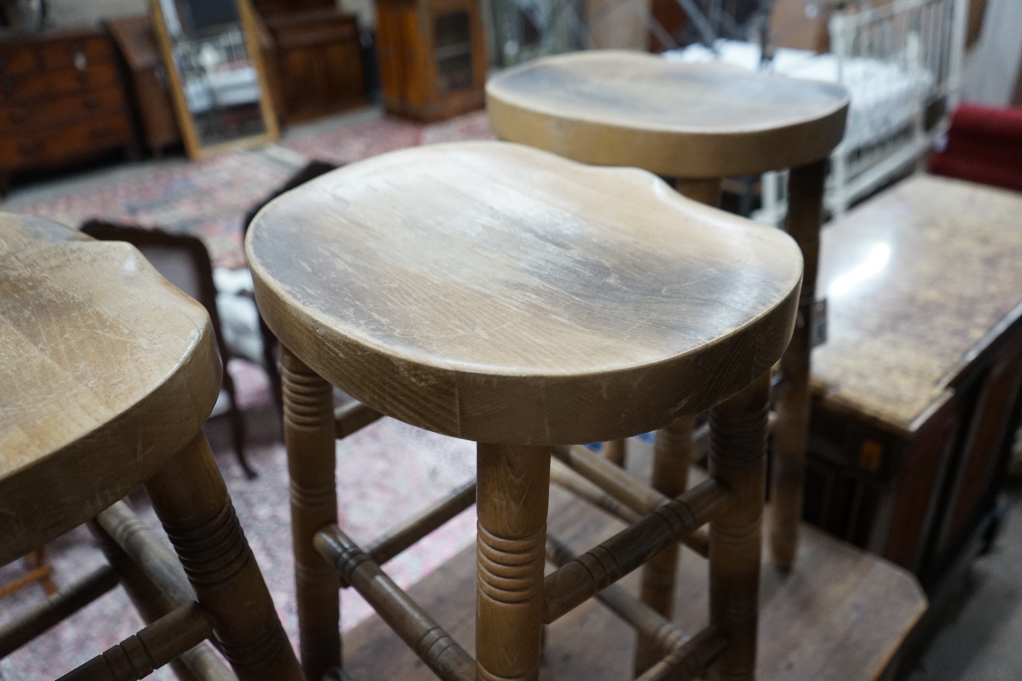 Three turned beech bar stools, height 77cm